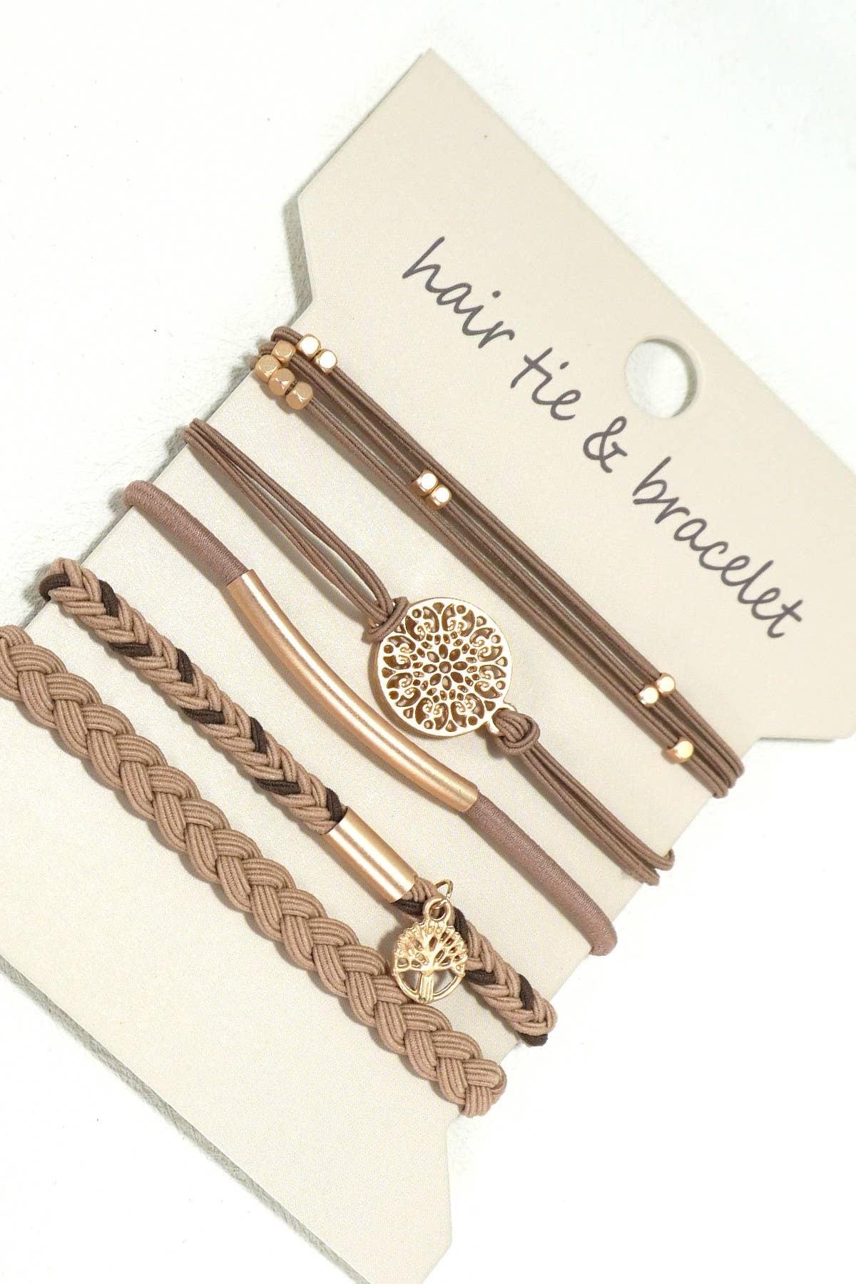 Set of hair tie and bracelet with decorative elements on a beige card