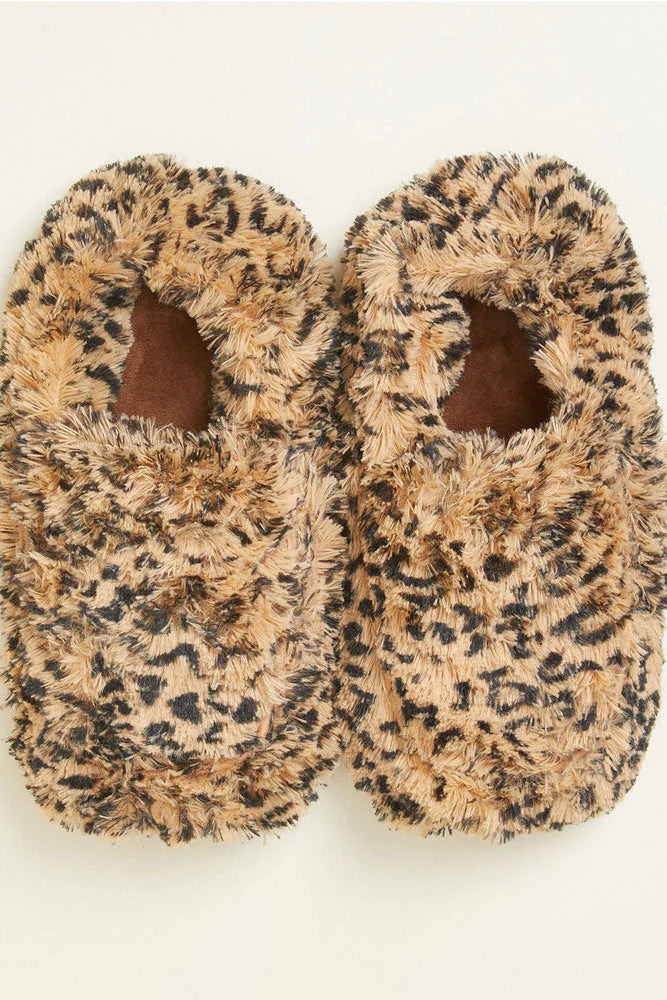 Pair of leopard print slippers on a white background