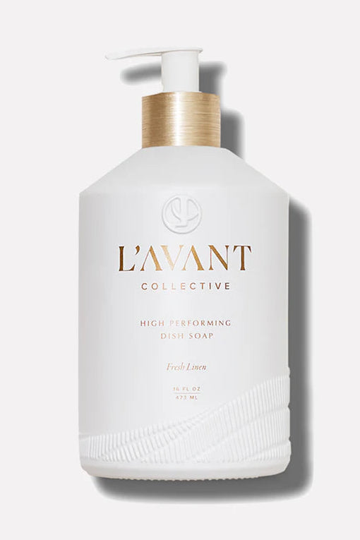 White bottle with gold pump labeled 'L'Avant Collective' on a white background