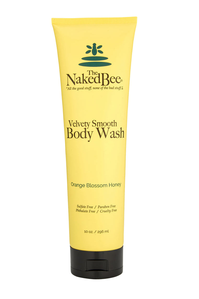 Yellow tube of Naked Bee body wash on a white background