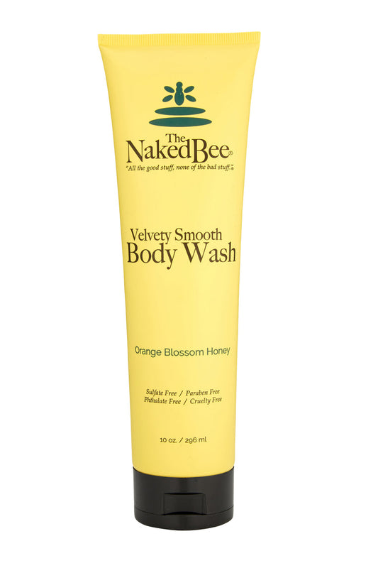 Yellow tube of Naked Bee body wash on a white background