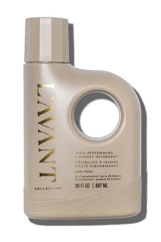 Beige laundry detergent bottle with gold text on a white background