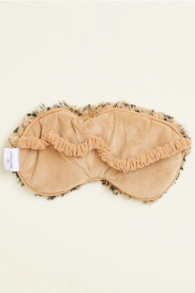 Beige eye mask with fluffy trim on a white background