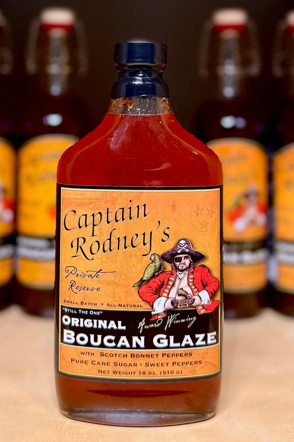 Bottle of Captain Rodney's Boucan Glaze with a label featuring a pirate design.