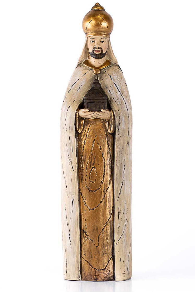 Wooden figurine with gold accents on a white background