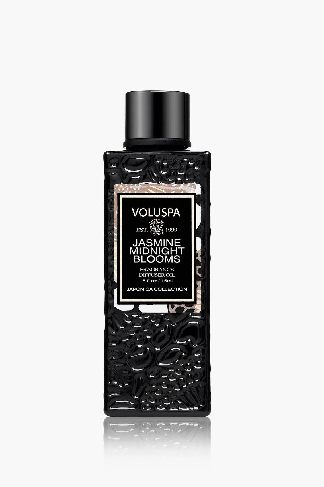 Black and silver Voluspa Jasmine Night Blooms fragrance bottle on a white background