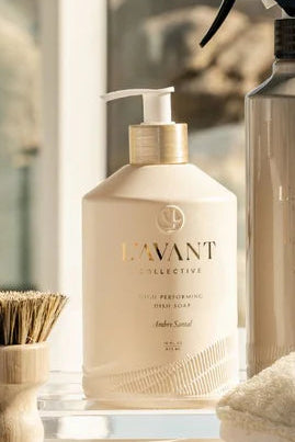 Set of LNVNT skincare products on a surface with a scenic background