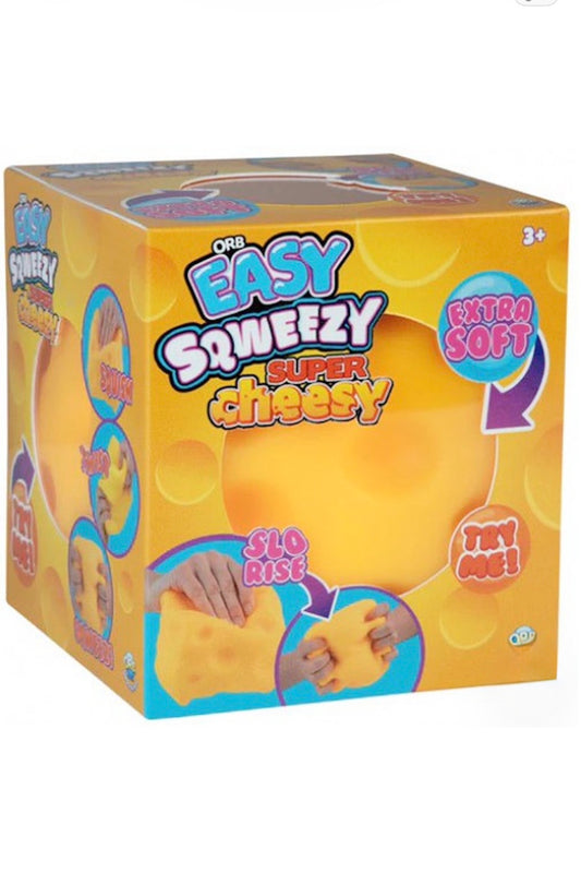 A box of 'One Easy Squeezzy Super Cheesy' toy, featuring a bright yellow and orange design with illustrations of hands squeezing the soft cheese-like toy.