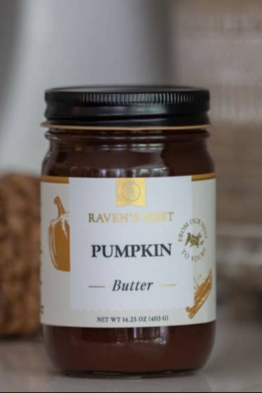Jar of pumpkin butter with a label on a blurred background