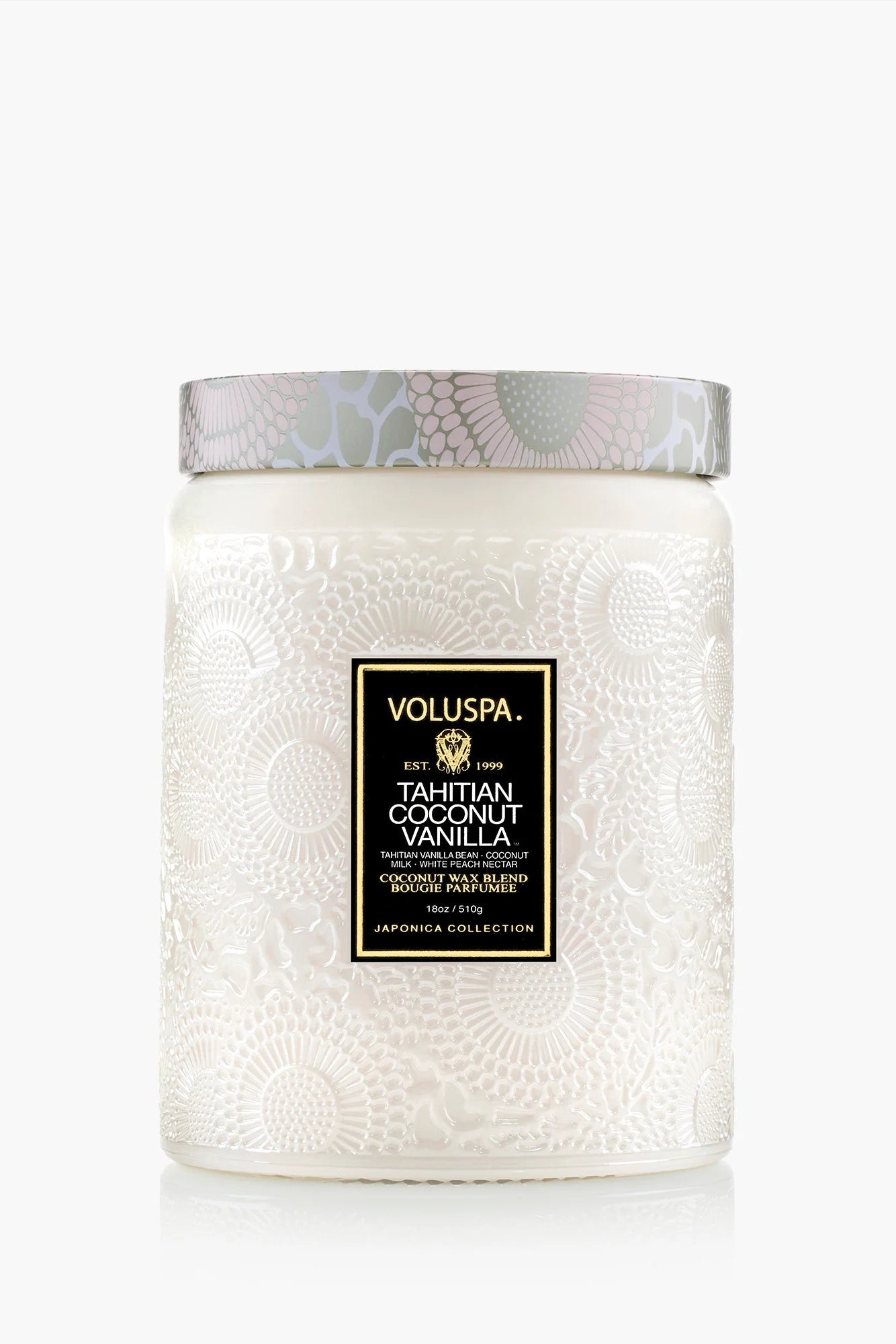 White textured candle with Voluspa label on a white background Voluspa Tahitian Coconut 18 0z Large Jar Candle