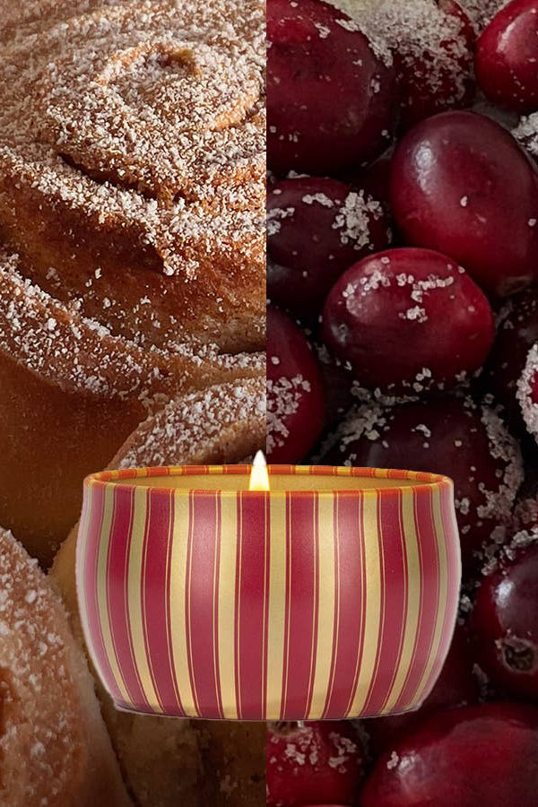 Cinnamon rolls and sugared cranberries with a striped candle in the center.  Velvet Rouge Holiday Tin Candle- 4 oz