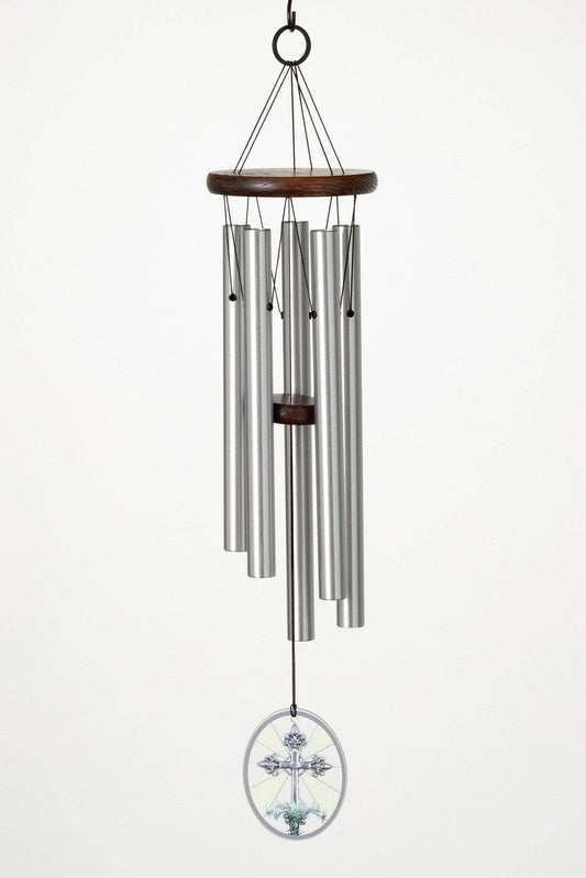 Memorial wind chime with lily and cross, metal tubes and wooden top on a white background